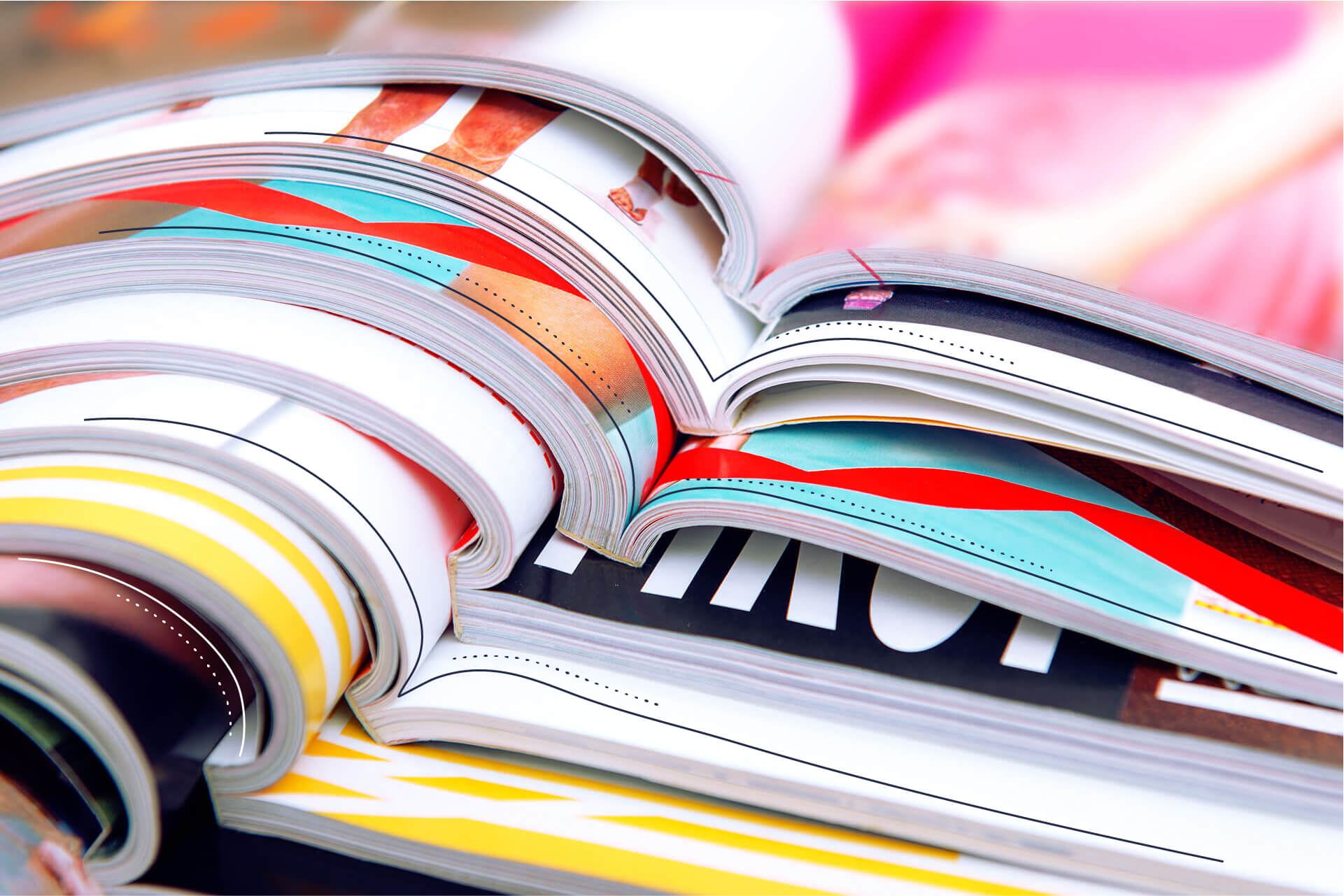 Colorful magazines stacked upon each other | eggheads.net